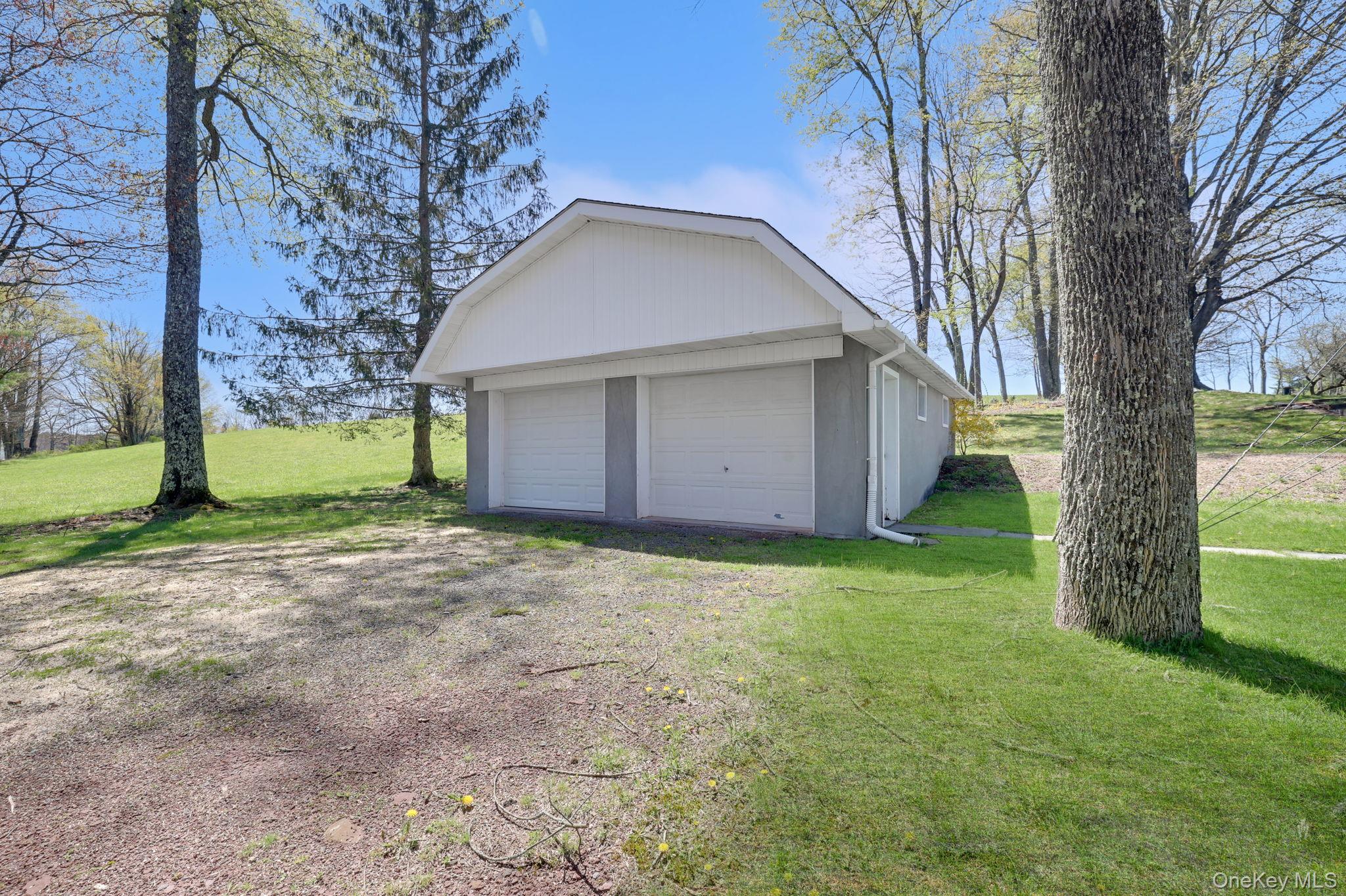 208 Shortcut Road Cochecton, NY 12726 - Photo 41 of 46 a view of a house with a yard and large tree