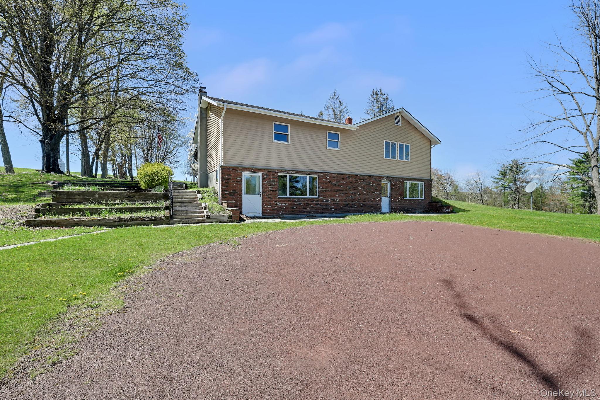 208 Shortcut Road Cochecton, NY 12726 - Photo 44 of 46 a front view of a house with a yard