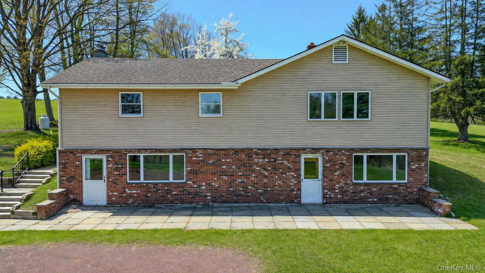 208 Shortcut Road Cochecton, NY 12726 - Photo 46 of 46 a front view of a house with a garden