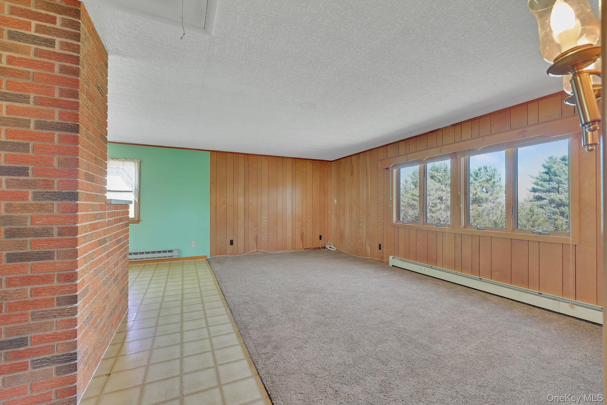 208 Shortcut Road Cochecton, NY 12726 - Photo 6 of 46 a view of an empty room with a window