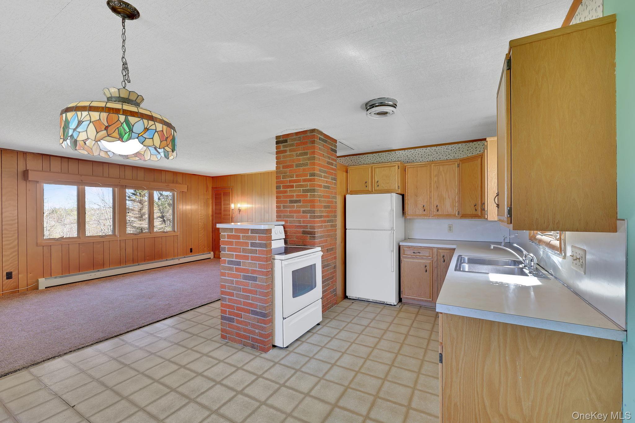 208 Shortcut Road Cochecton, NY 12726 - Photo 9 of 46 a kitchen that has a lot of cabinets and a wooden floor