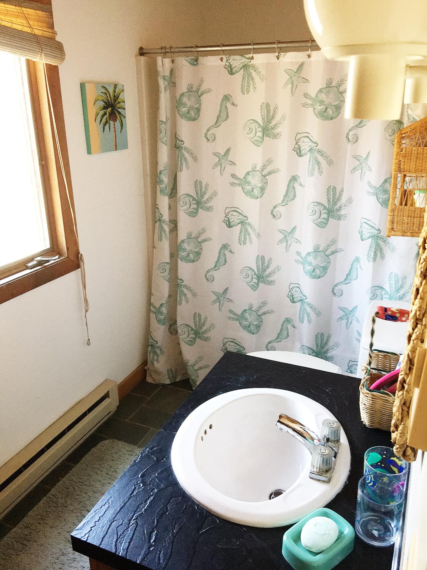 10 Pine Valley Road Wellfleet, MA 02667 - Photo 13 of 27 a bathroom with a sink and a mirror