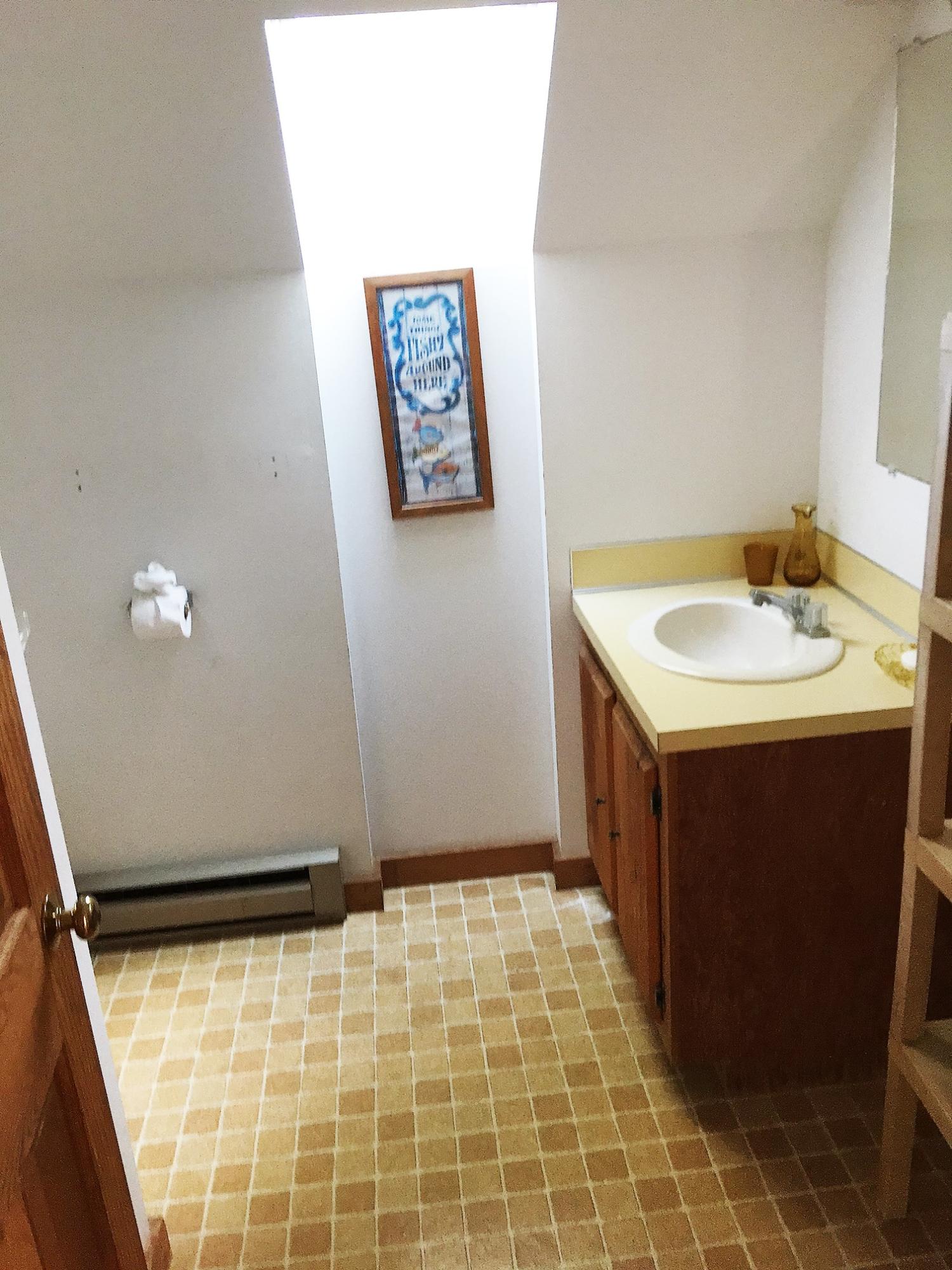 10 Pine Valley Road Wellfleet, MA 02667 - Photo 18 of 27 a bathroom with a sink a vanity and a mirror