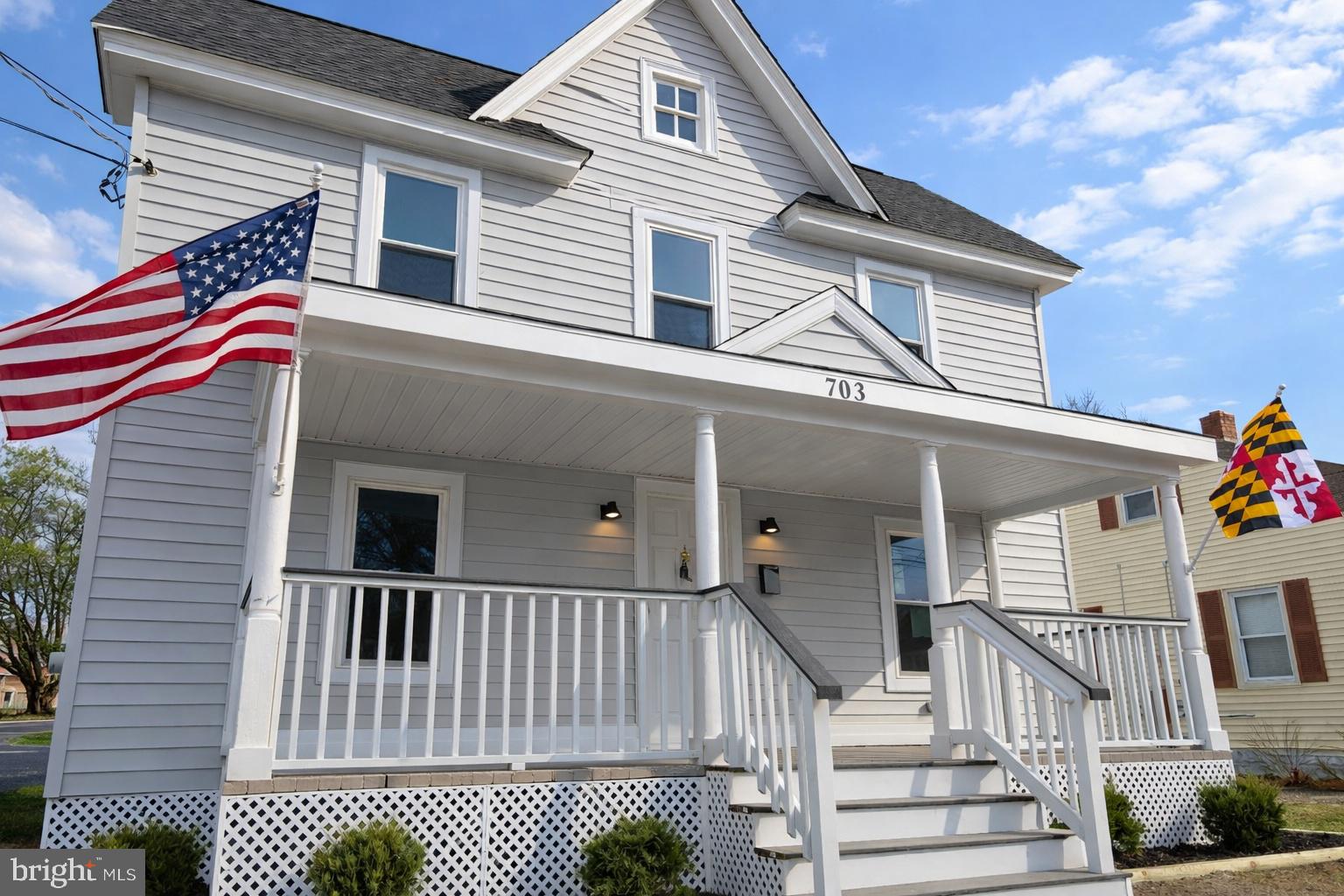 703 Madison Street Salisbury, MD 21804 - Photo 1 of 22 a view of a house with a small yard and wooden fence