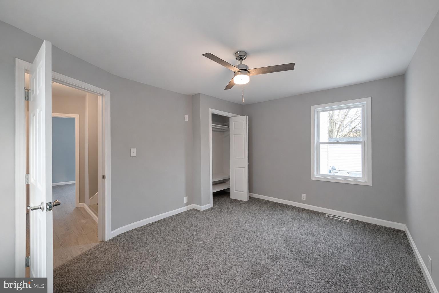 703 Madison Street Salisbury, MD 21804 - Photo 13 of 22 a view of empty room with window and ceiling fan