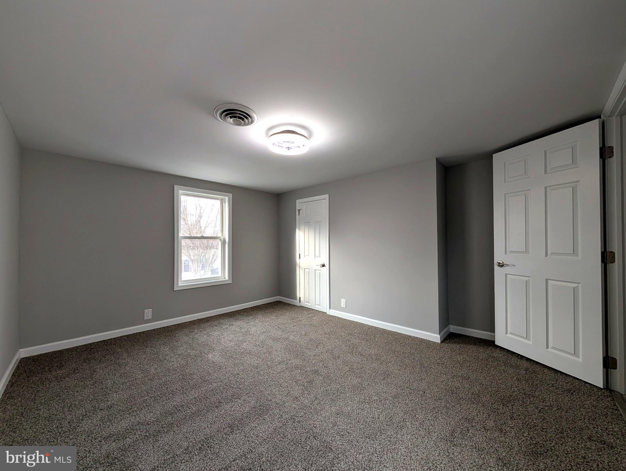 703 Madison Street Salisbury, MD 21804 - Photo 16 of 22 a view of an empty room with a window