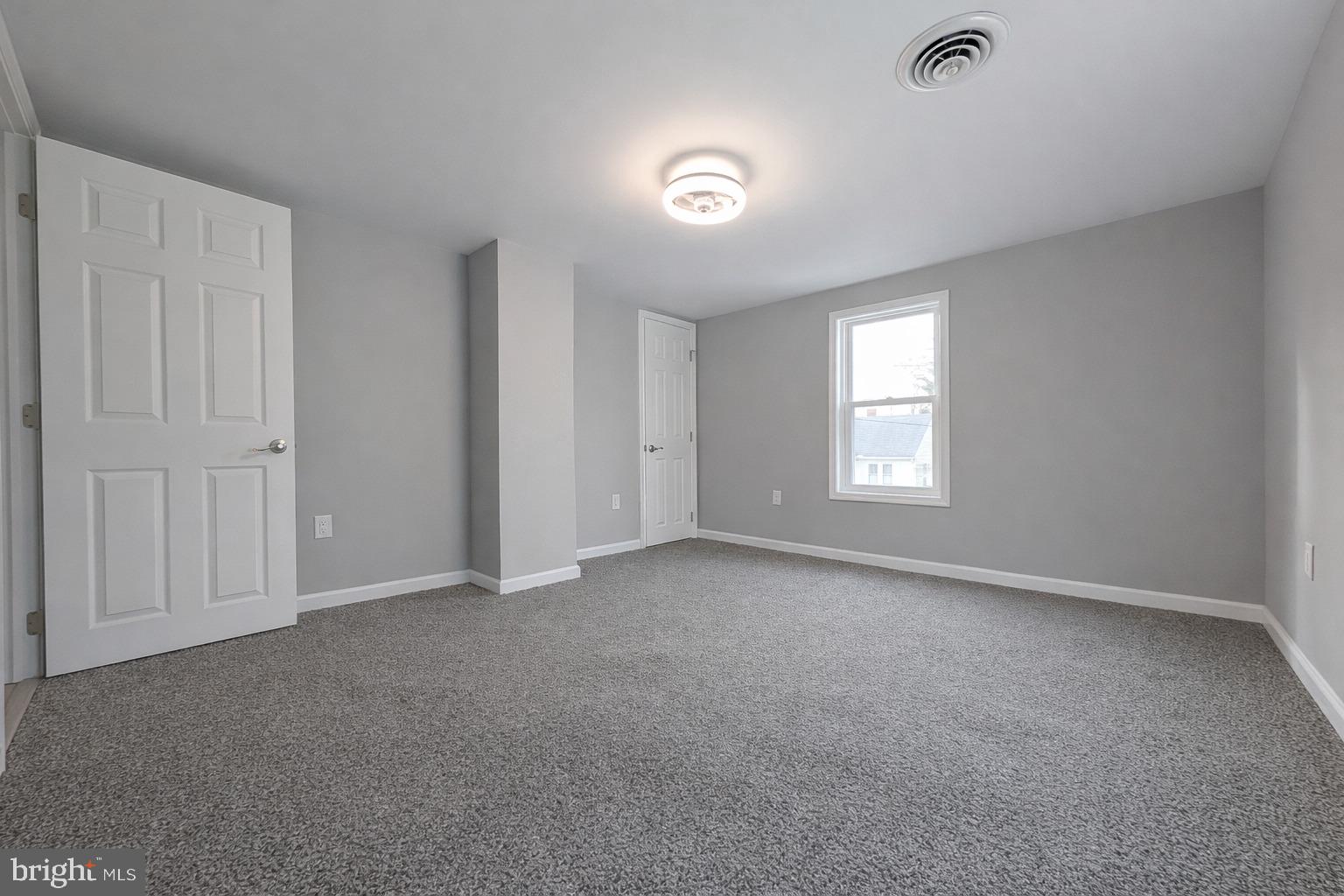 703 Madison Street Salisbury, MD 21804 - Photo 17 of 22 a view of an empty room with a window