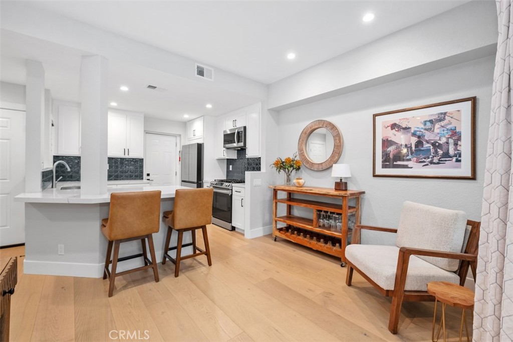 26 Sunbridge Place Dana Point, CA 92629 - Photo 3 of 15 a living room with furniture a rug and a wall painting
