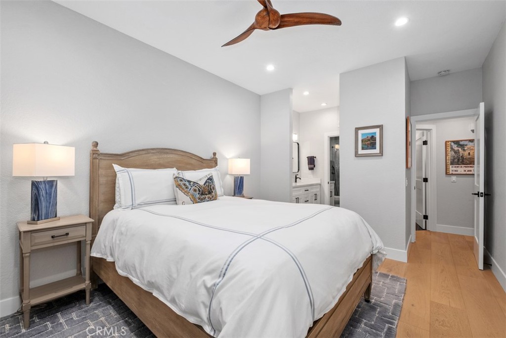 26 Sunbridge Place Dana Point, CA 92629 - Photo 8 of 15 a bedroom with bed and a chandelier