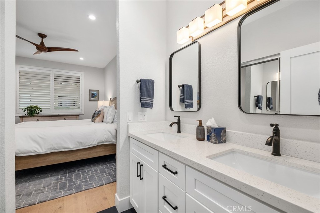 26 Sunbridge Place Dana Point, CA 92629 - Photo 9 of 15 a en suite bathroom with double vanity sinks and a mirror