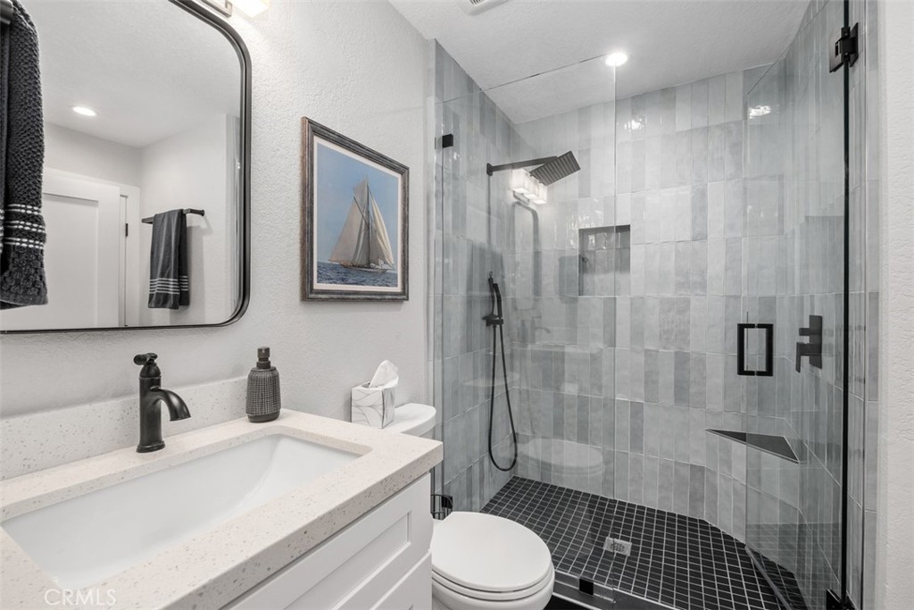 26 Sunbridge Place Dana Point, CA 92629 - Photo 10 of 15 a bathroom with a sink a toilet and shower