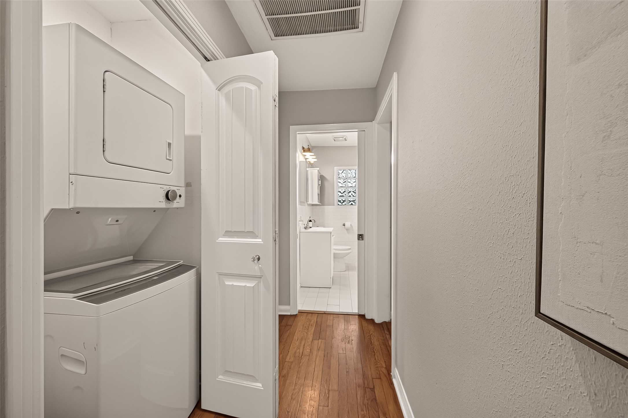 2019 Gostick Street Houston, TX 77008 - Photo 24 of 36 a kitchen with a refrigerator and cabinets