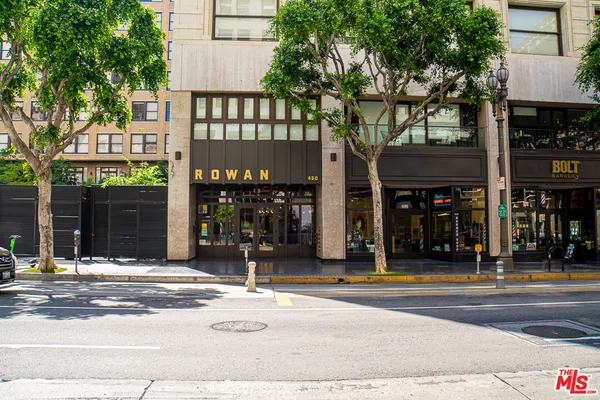a outdoor view of a building with traffic signal lights