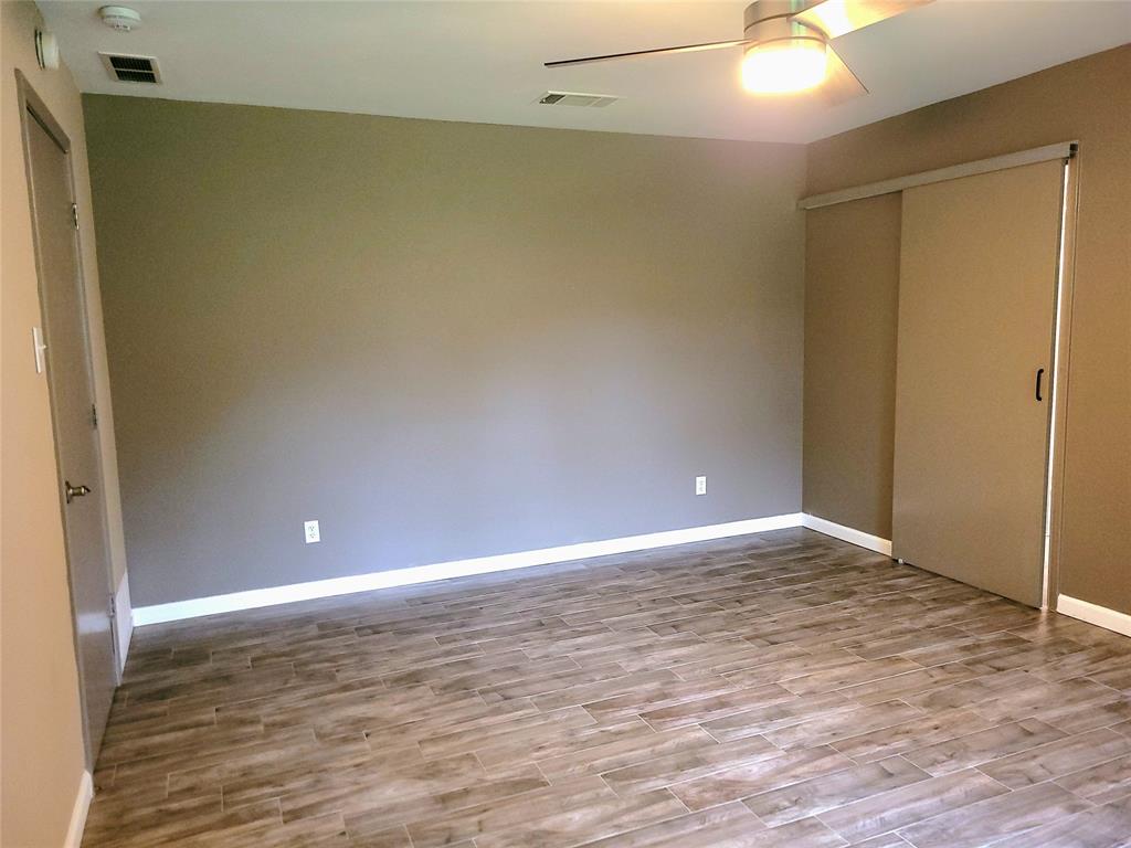 912 North Dove Road Grapevine, TX 76051 - Photo 20 of 36 a view of an empty room with wooden floor