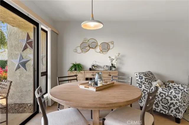 a view of a dining room with furniture window and outside view