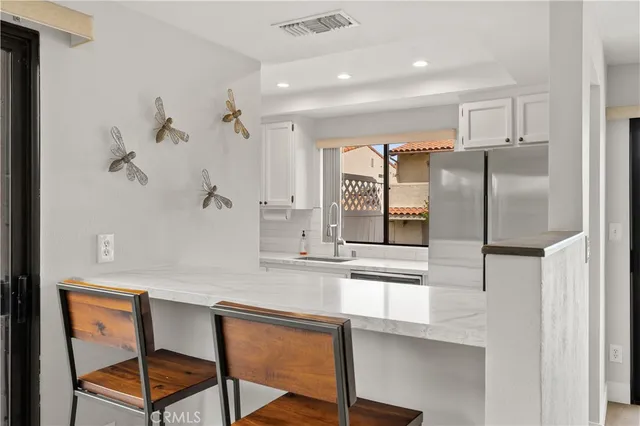 a view of a livingroom with furniture and a window