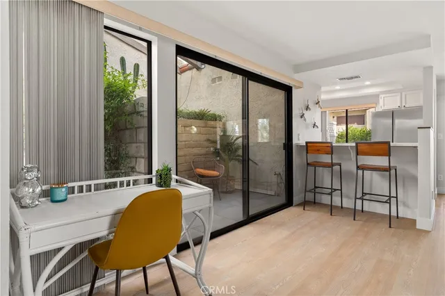 a living room with a large window and a table