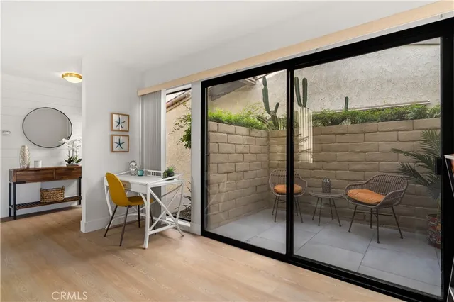 a backyard of a house with table and chairs