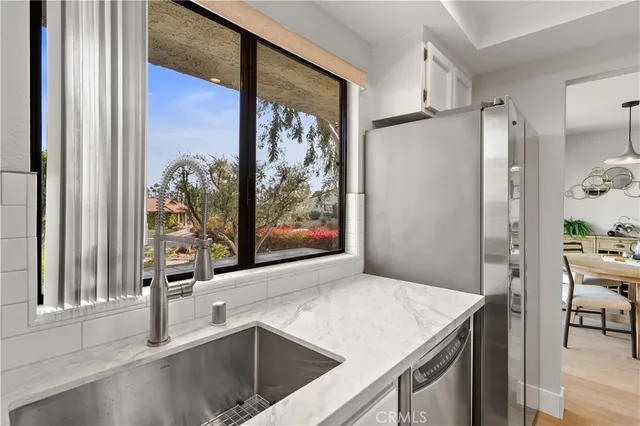 a kitchen with a sink stove and microwave