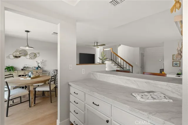 a view of entryway with wooden floor and stairs