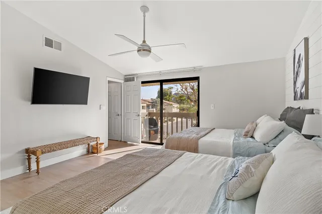 a balcony with wooden floor and fence