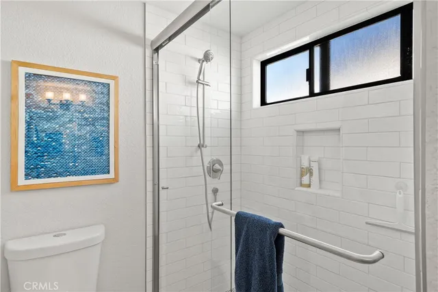 an aerial view of a house with a swimming pool outdoor seating and yard