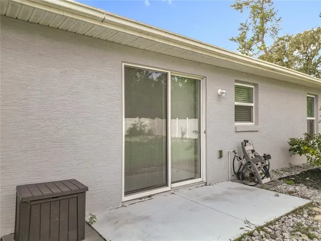 a view of backyard with seating space