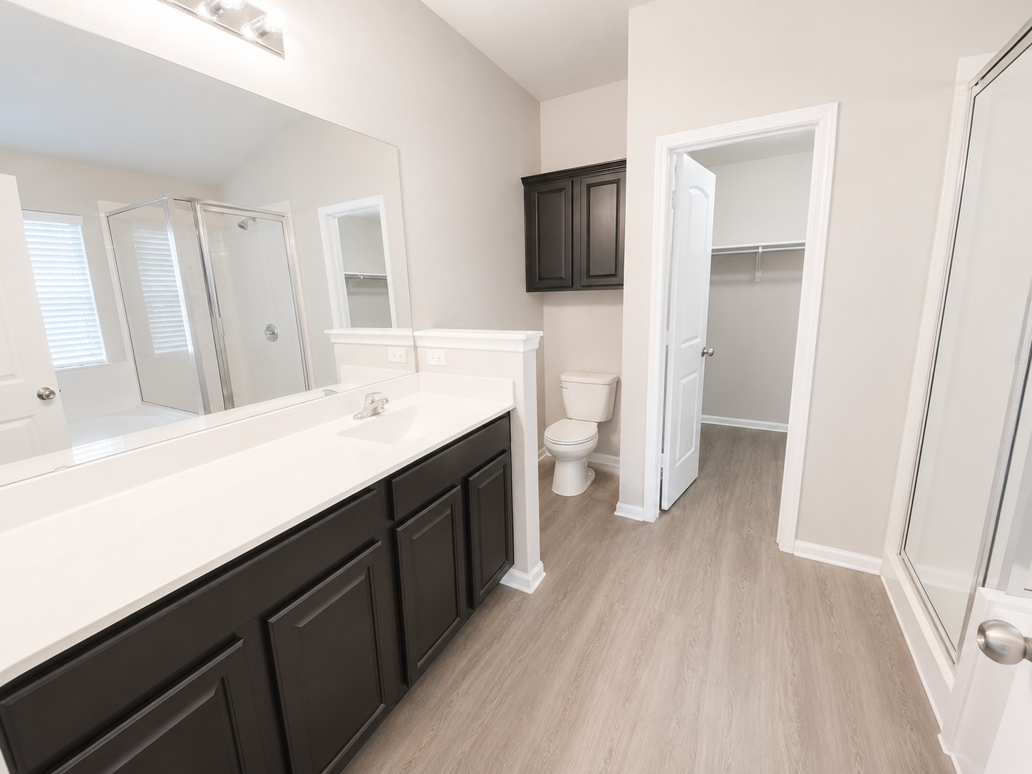 228 Avalanche Avenue Georgetown, TX 78626 - Photo 10 of 16 a spacious bathroom with a double vanity sink and a mirror