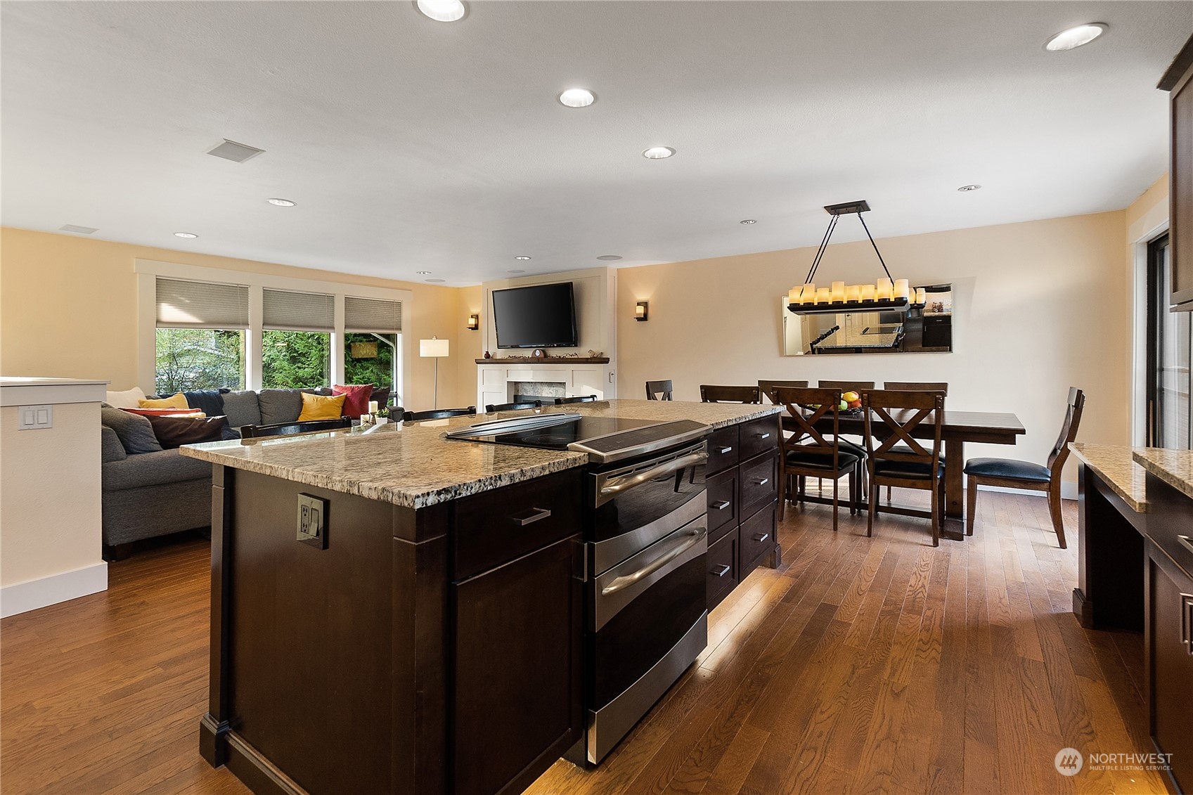 18434 129th Lane Northeast Bothell, WA 98011 - Photo 11 of 33 a kitchen with stainless steel appliances granite countertop a stove and a wooden floors