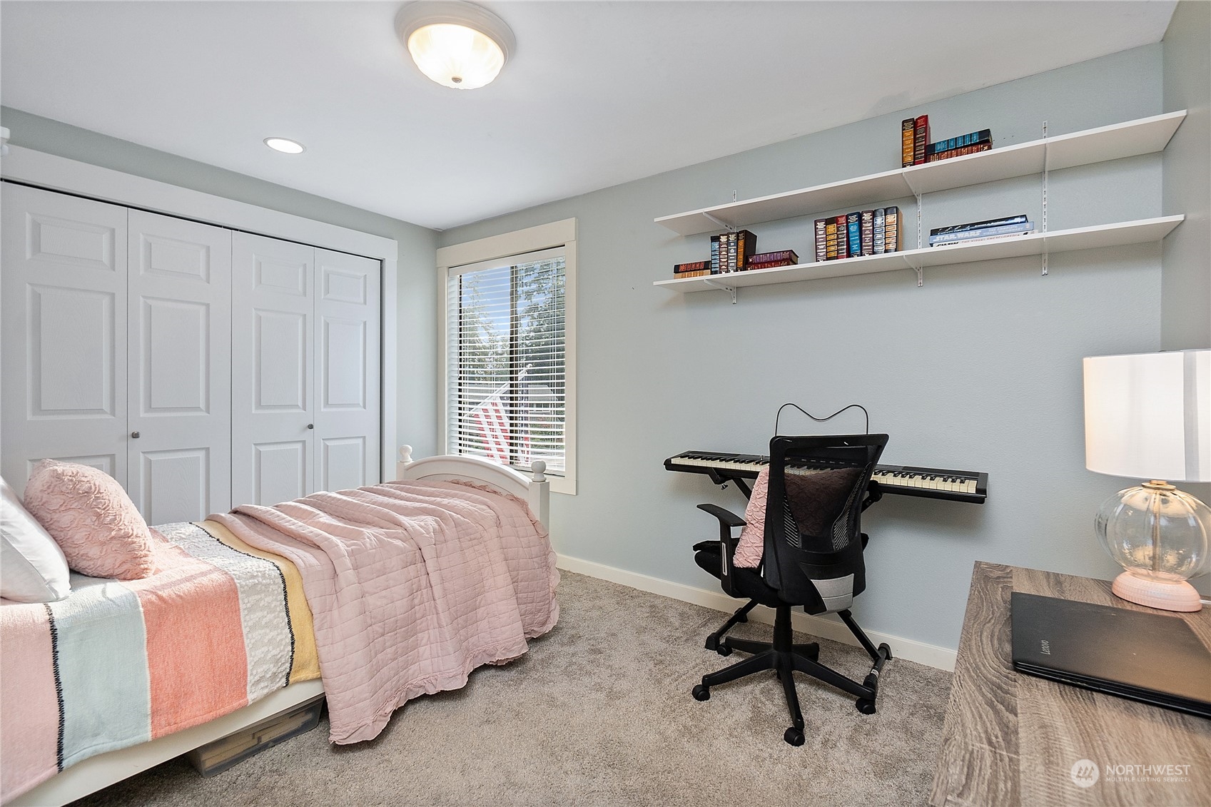 18434 129th Lane Northeast Bothell, WA 98011 - Photo 16 of 33 a bedroom with a bed a desk and chair