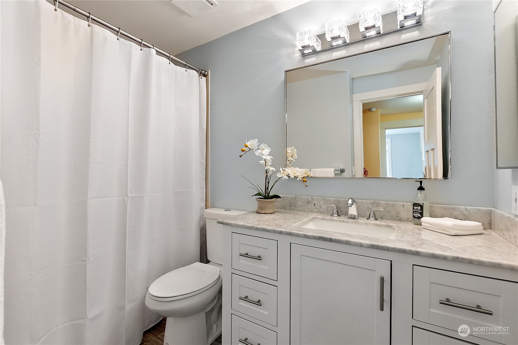 18434 129th Lane Northeast Bothell, WA 98011 - Photo 18 of 33 a bathroom with a granite countertop sink toilet and mirror