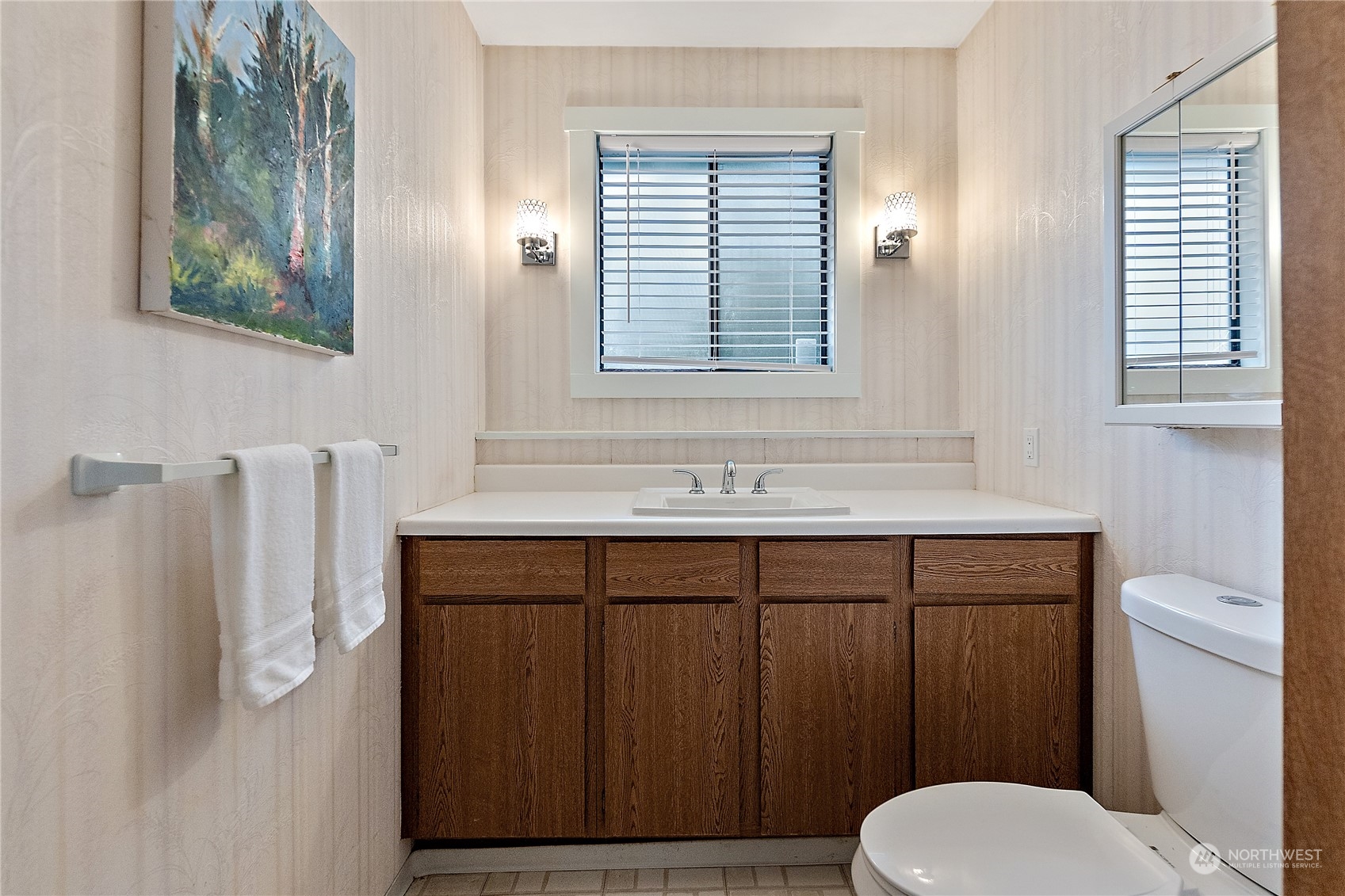 18434 129th Lane Northeast Bothell, WA 98011 - Photo 24 of 33 a bathroom with a sink a toilet and mirror