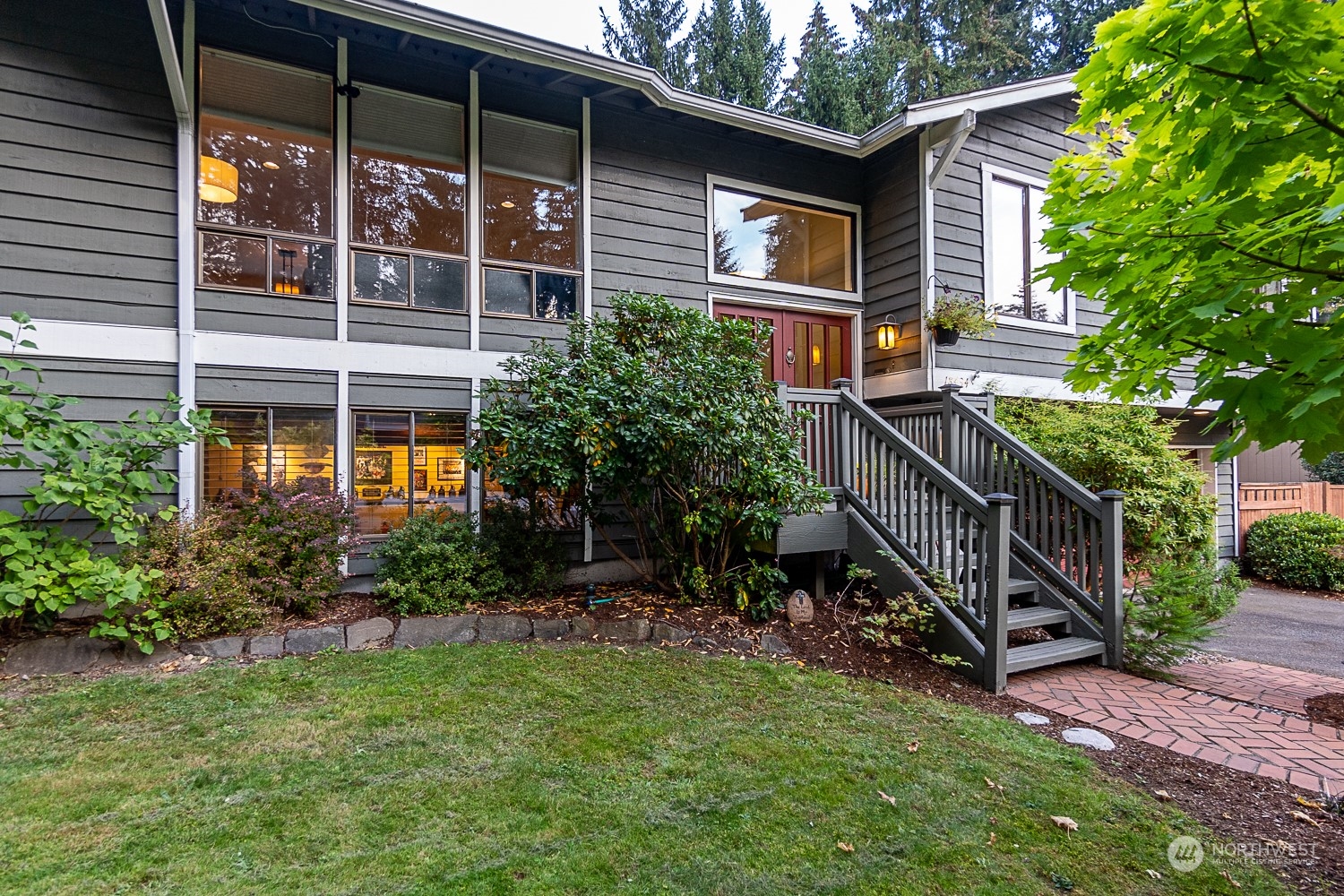 18434 129th Lane Northeast Bothell, WA 98011 - Photo 26 of 33 a view of a house with a yard and sitting area