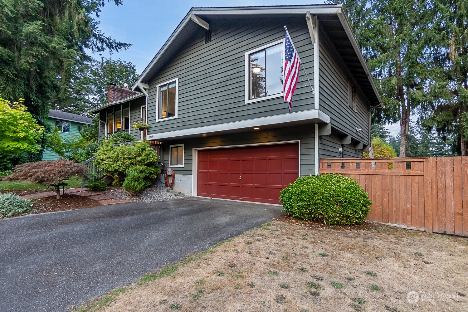 18434 129th Lane Northeast Bothell, WA 98011 - Photo 27 of 33 a front view of a house with a yard and garage