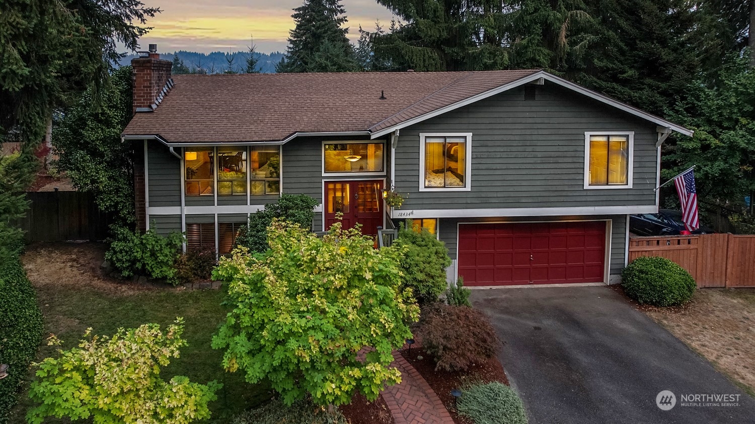 18434 129th Lane Northeast Bothell, WA 98011 - Photo 31 of 33 a front view of a house with a yard and garage
