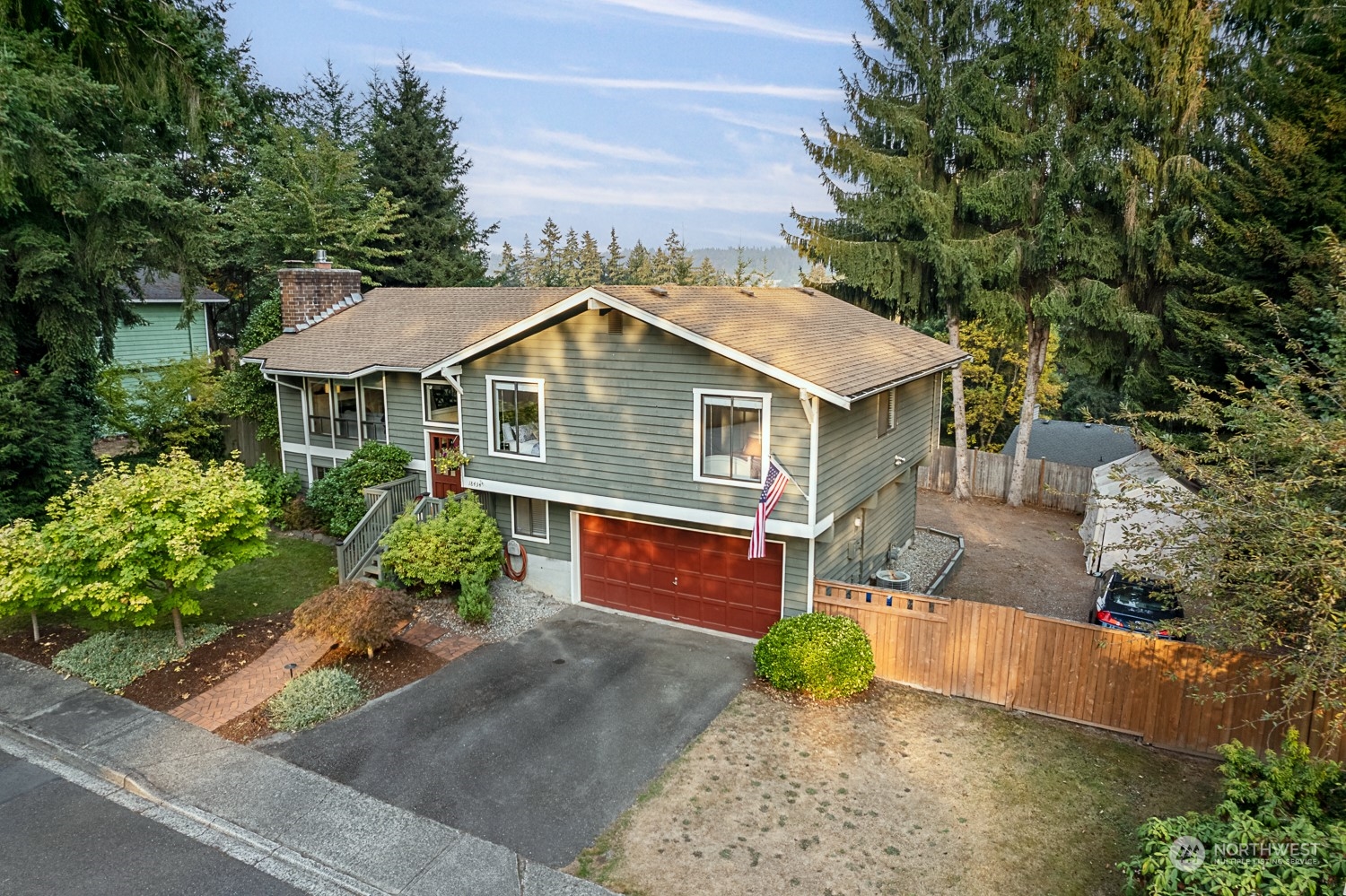 18434 129th Lane Northeast Bothell, WA 98011 - Photo 32 of 33 a front view of a house with a yard