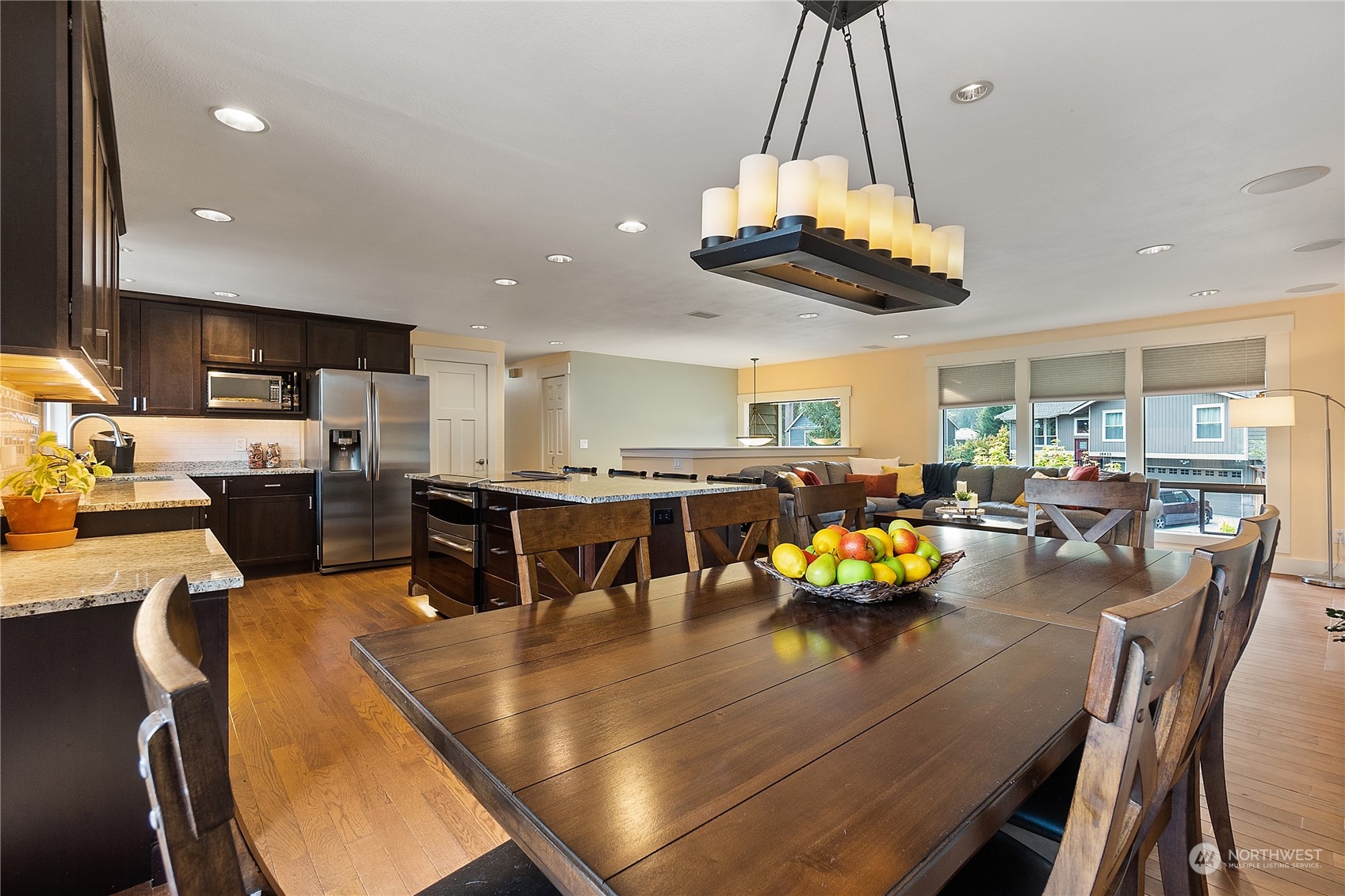 18434 129th Lane Northeast Bothell, WA 98011 - Photo 4 of 33 a kitchen with a table chairs and a chandelier