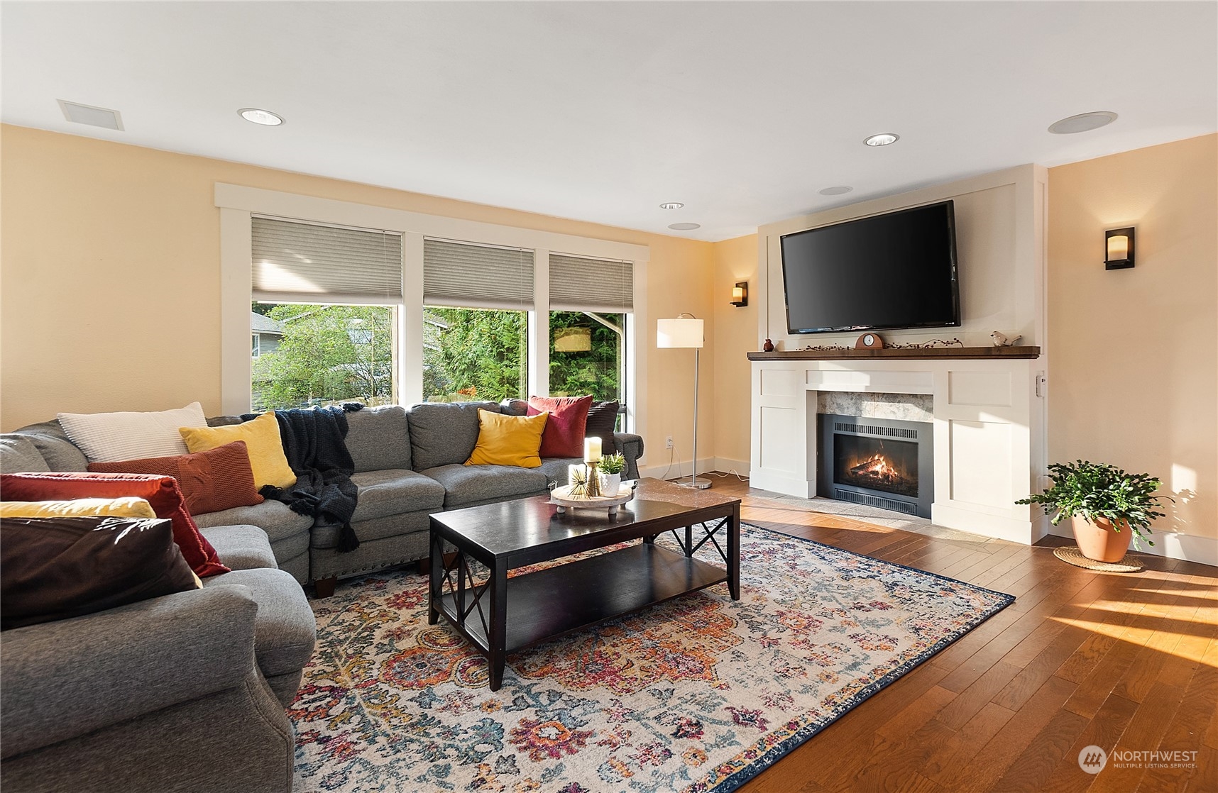 18434 129th Lane Northeast Bothell, WA 98011 - Photo 8 of 33 a living room with furniture a flat screen tv and a fireplace
