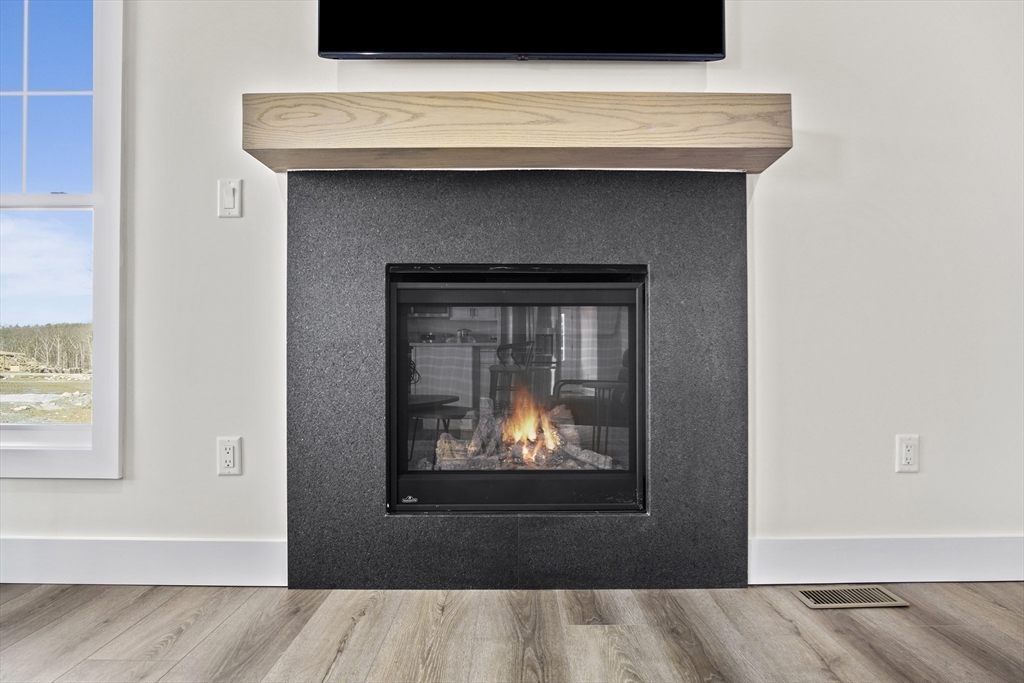 25 Salisbury Hill Boulevard, Unit 67 Worcester, MA 01609 - Photo 12 of 42 a close view of a fireplace in a room