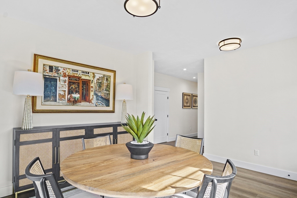 25 Salisbury Hill Boulevard, Unit 67 Worcester, MA 01609 - Photo 14 of 42 a view of a dining room with furniture and wooden floor