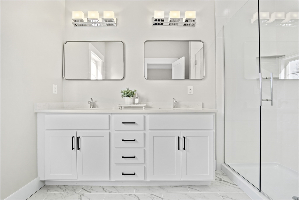 25 Salisbury Hill Boulevard, Unit 67 Worcester, MA 01609 - Photo 18 of 42 a bathroom with double vanity sink two mirror and