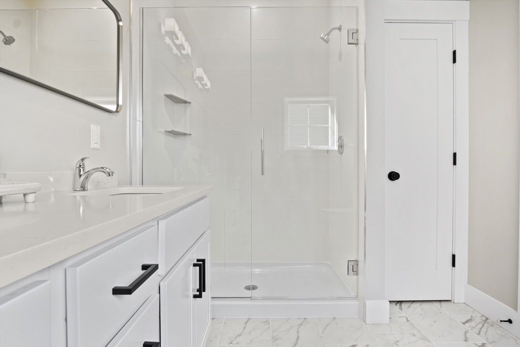25 Salisbury Hill Boulevard, Unit 67 Worcester, MA 01609 - Photo 19 of 42 a bathroom with a shower and a sink