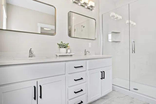 a bathroom with a sink and mirror