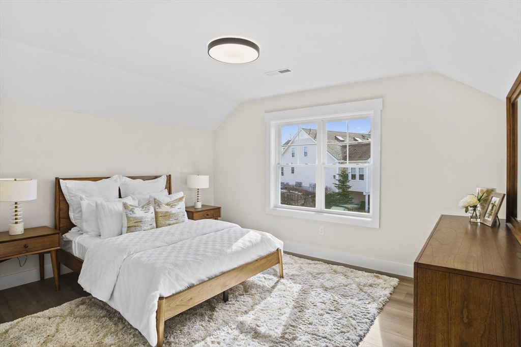 25 Salisbury Hill Boulevard, Unit 67 Worcester, MA 01609 - Photo 23 of 42 a bedroom with bed and a window