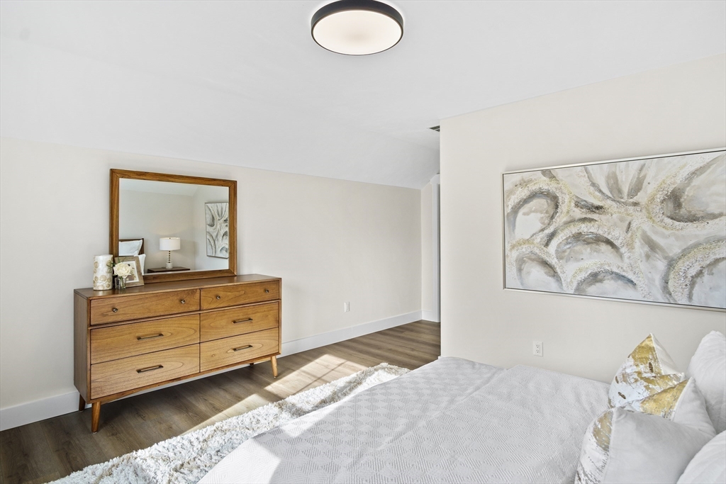 25 Salisbury Hill Boulevard, Unit 67 Worcester, MA 01609 - Photo 24 of 42 a bedroom with a bed and a dresser