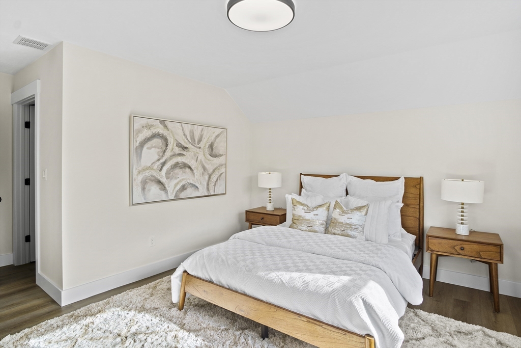 25 Salisbury Hill Boulevard, Unit 67 Worcester, MA 01609 - Photo 25 of 42 a bedroom with a bed and a night stand