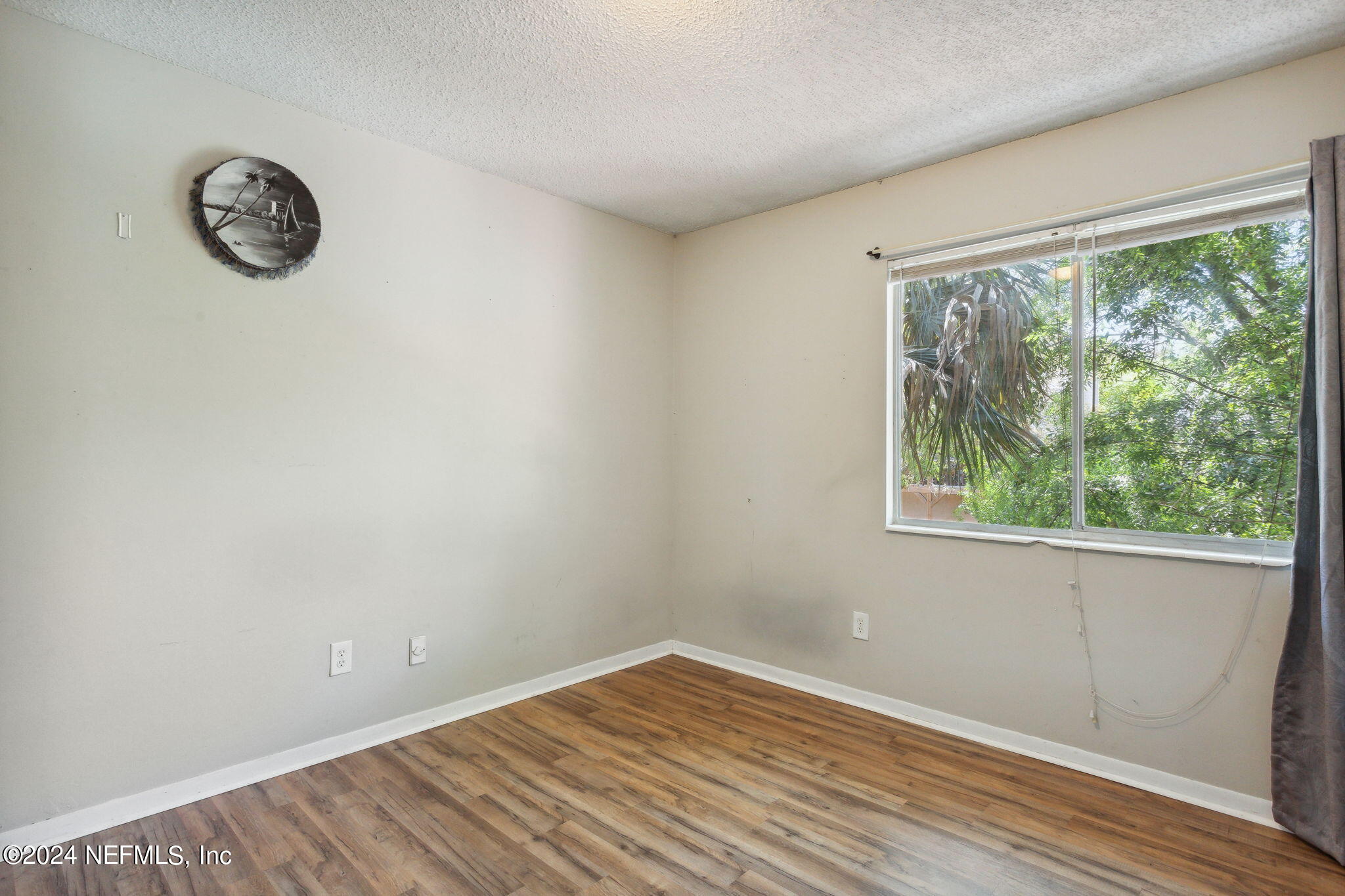 1154 Penman Road Jacksonville Beach, FL 32250 - Photo 14 of 20 an empty room with a window