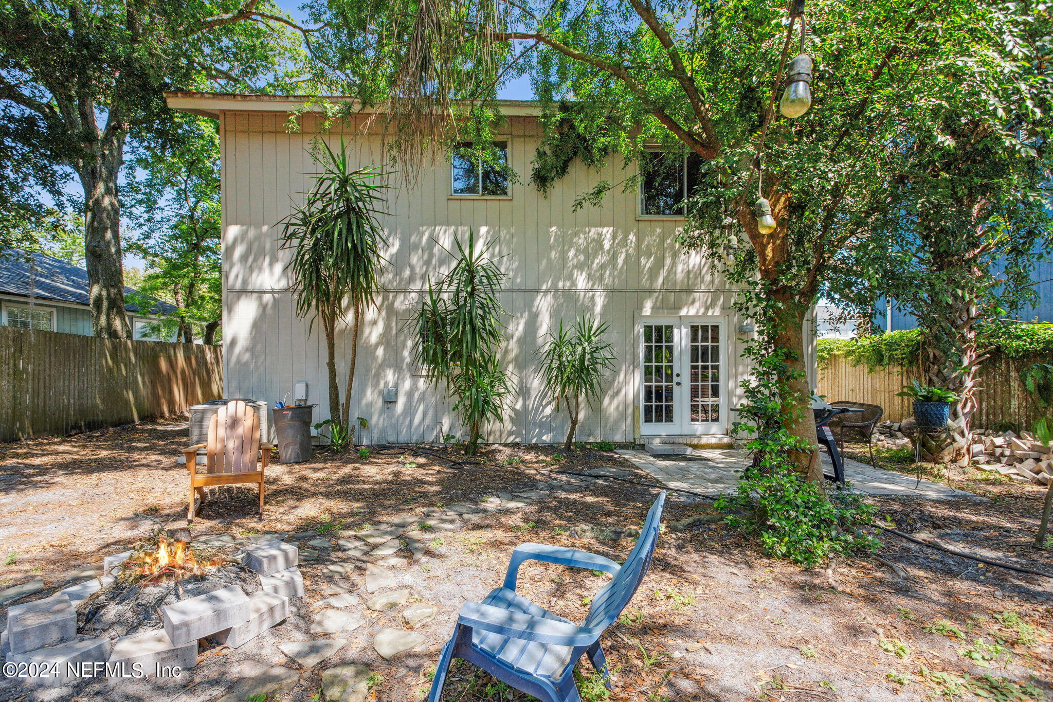 1154 Penman Road Jacksonville Beach, FL 32250 - Photo 19 of 20 a backyard of a house with outdoor seating