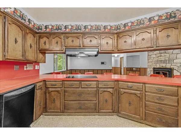 a view of a kitchen with cabinets