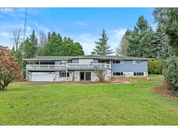 a house view with a sitting space and garden